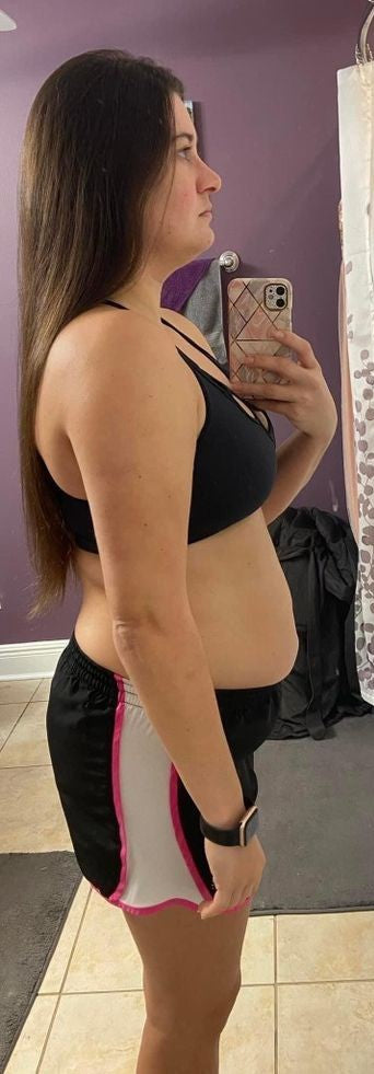 Woman taking a mirror selfie wearing before 30 days of using energyze