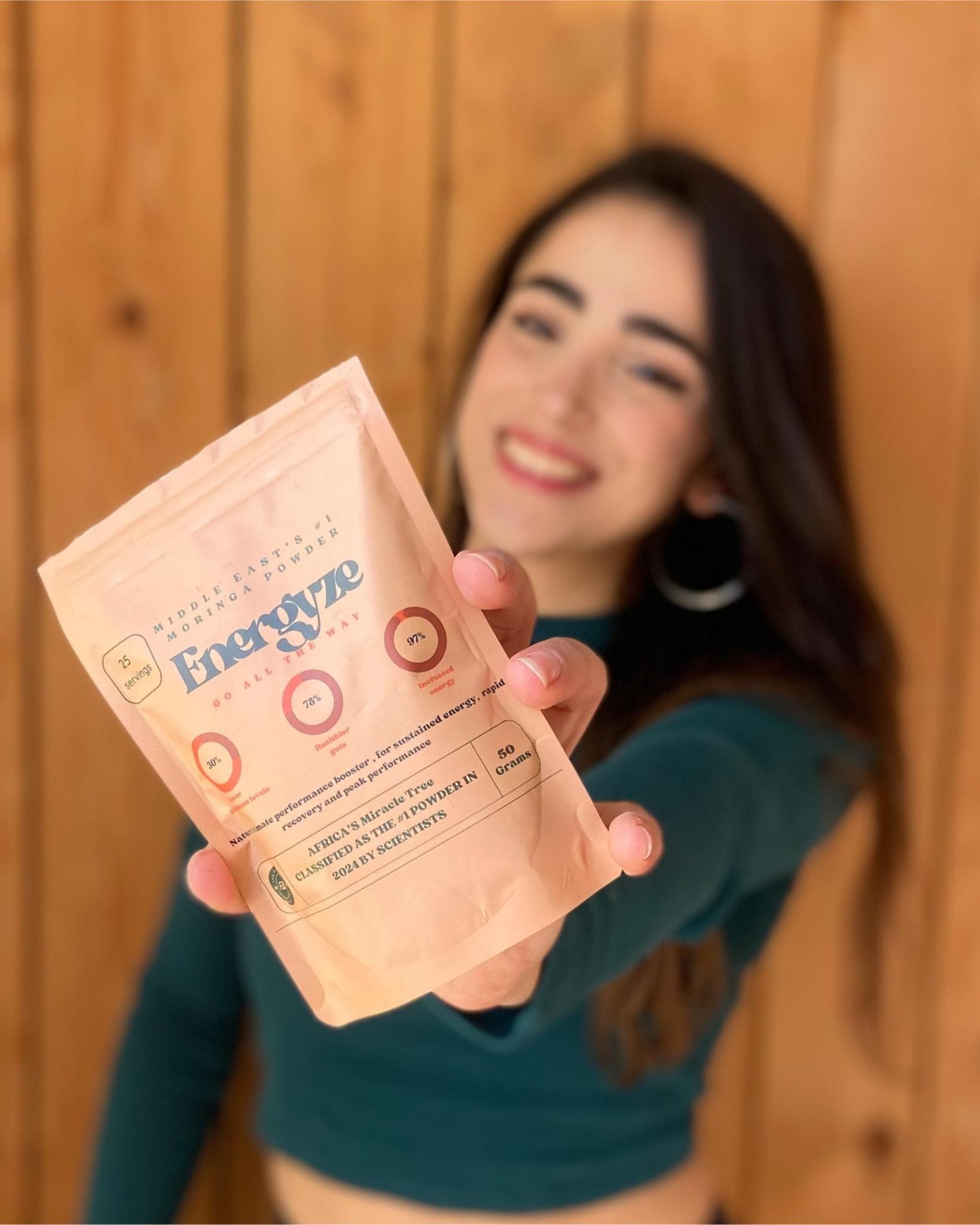 Cara atallah lebanese runner holding an Energyze bag in her hand